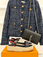 Louis Vuitton black platform espadrille sandals with cherry-pattern straps and ankle buckle.