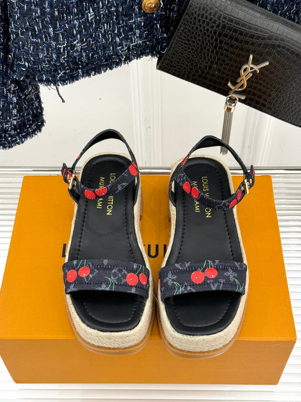 Louis Vuitton black espadrille platform sandals with cherry-pattern straps and gold-tone buckles.