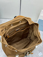 Prada tan backpack interior view with open top compartment and front zipper pocket