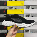 Black suede lace-up sneaker with white chunky sole and side logo