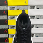 Black suede lace-up sneaker heel and collar, white outsole edge