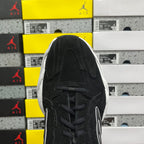 Black lace-up sneaker tongue and eyelets, suede upper