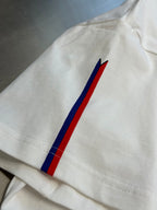 White Louis Vuitton T-shirt sleeve with blue and red stripe graphic