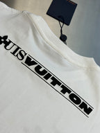 White Louis Vuitton T-shirt with large black “Louis Vuitton” chest logo