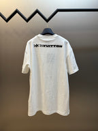 White Louis Vuitton T-shirt, back view with “Louis Vuitton” logo print