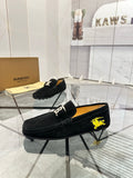 Burberry black loafer with yellow horse emblem and gold-tone buckle detail