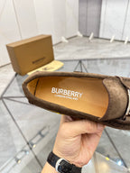 Brown suede loafer insole view showing BURBERRY LONDON ENGLAND branding.