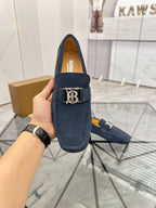 Navy suede loafer with gold-tone B buckle, front view