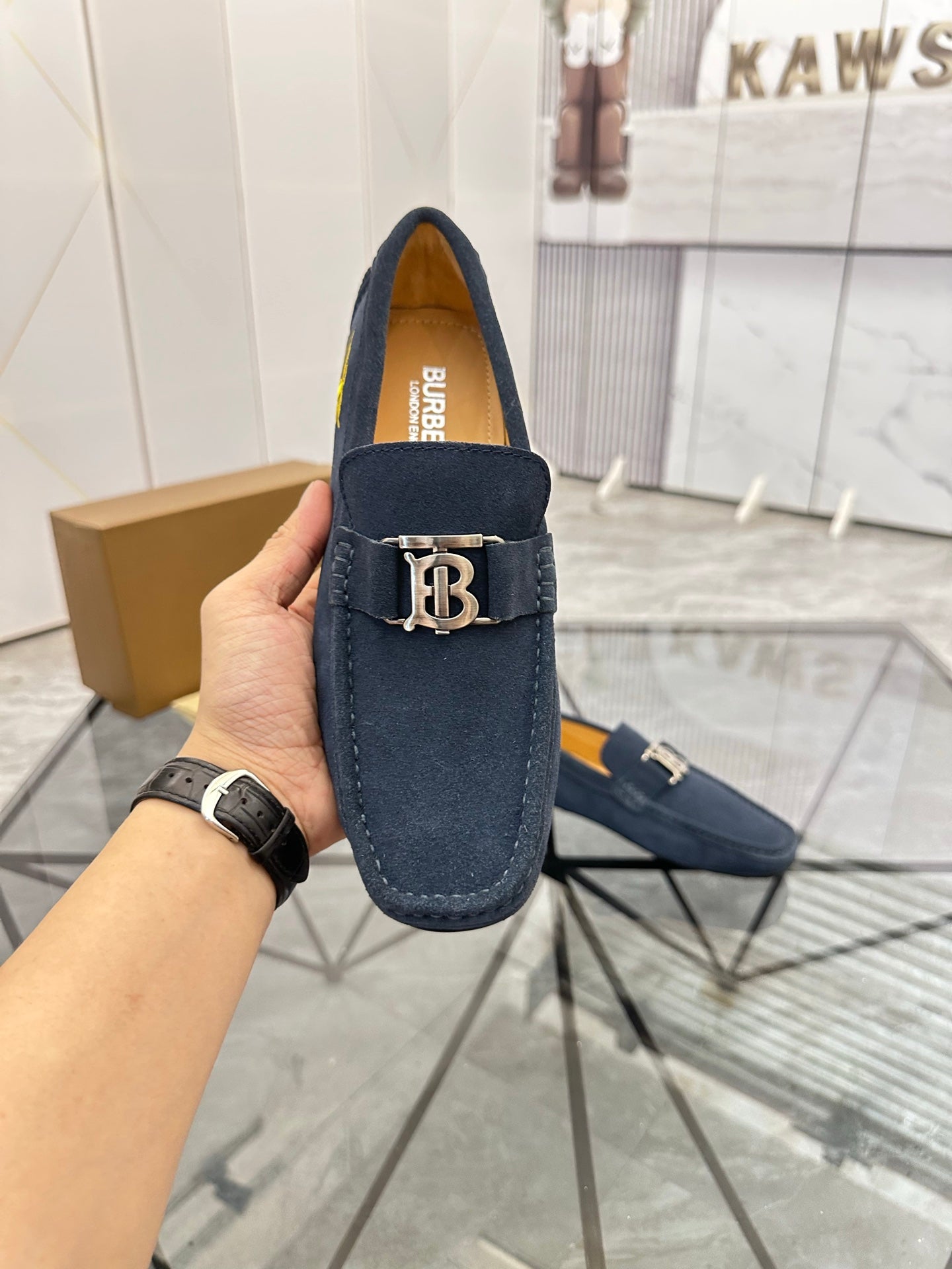 Navy suede loafer with gold-tone B buckle, front view