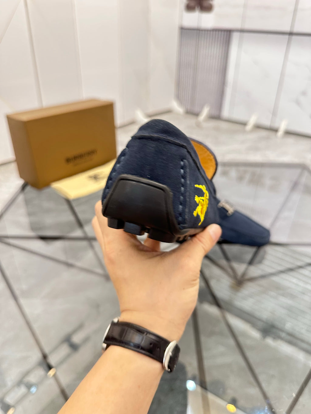 Navy suede loafer heel view with dark rubber sole
