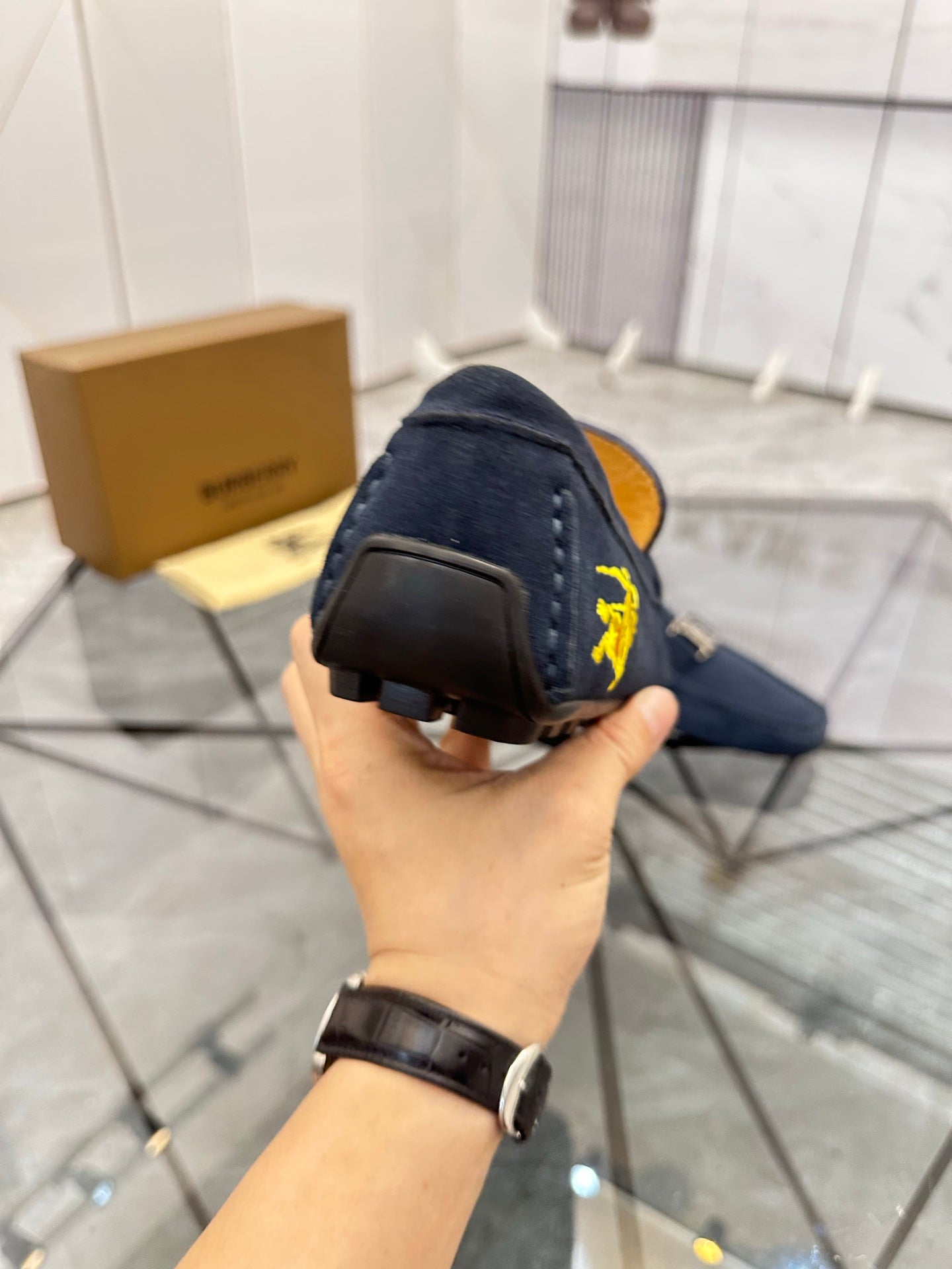 Navy suede loafer heel view with dark rubber sole