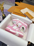 Pink and white Louis Vuitton sneakers in open box with tissue