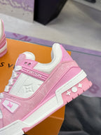 Pink and white Louis Vuitton sneaker close-up with VUITTON heel logo