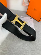 Hermes belt, black leather with gold-tone H buckle and keeper strap