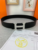 Hermes belt, black textured leather with silver-tone H buckle detail