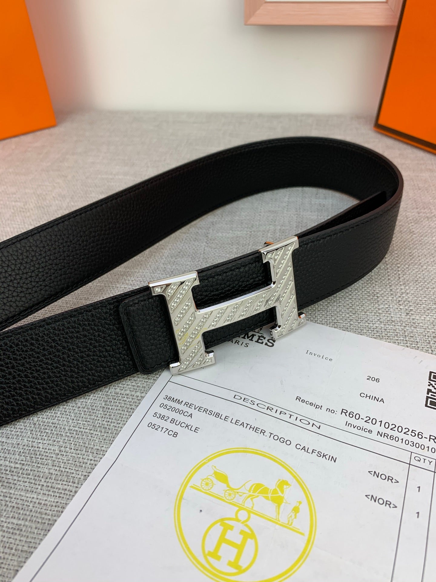 Hermes belt, black leather with silver-tone H buckle and engraved front plate