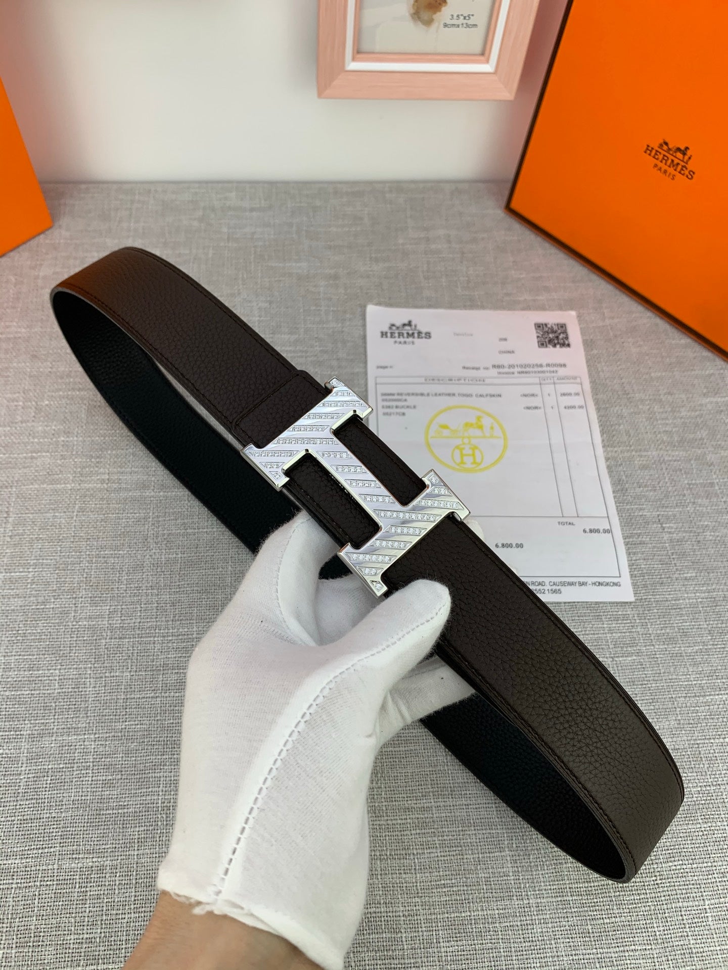 Hermes belt with dark leather strap and silver double H buckle
