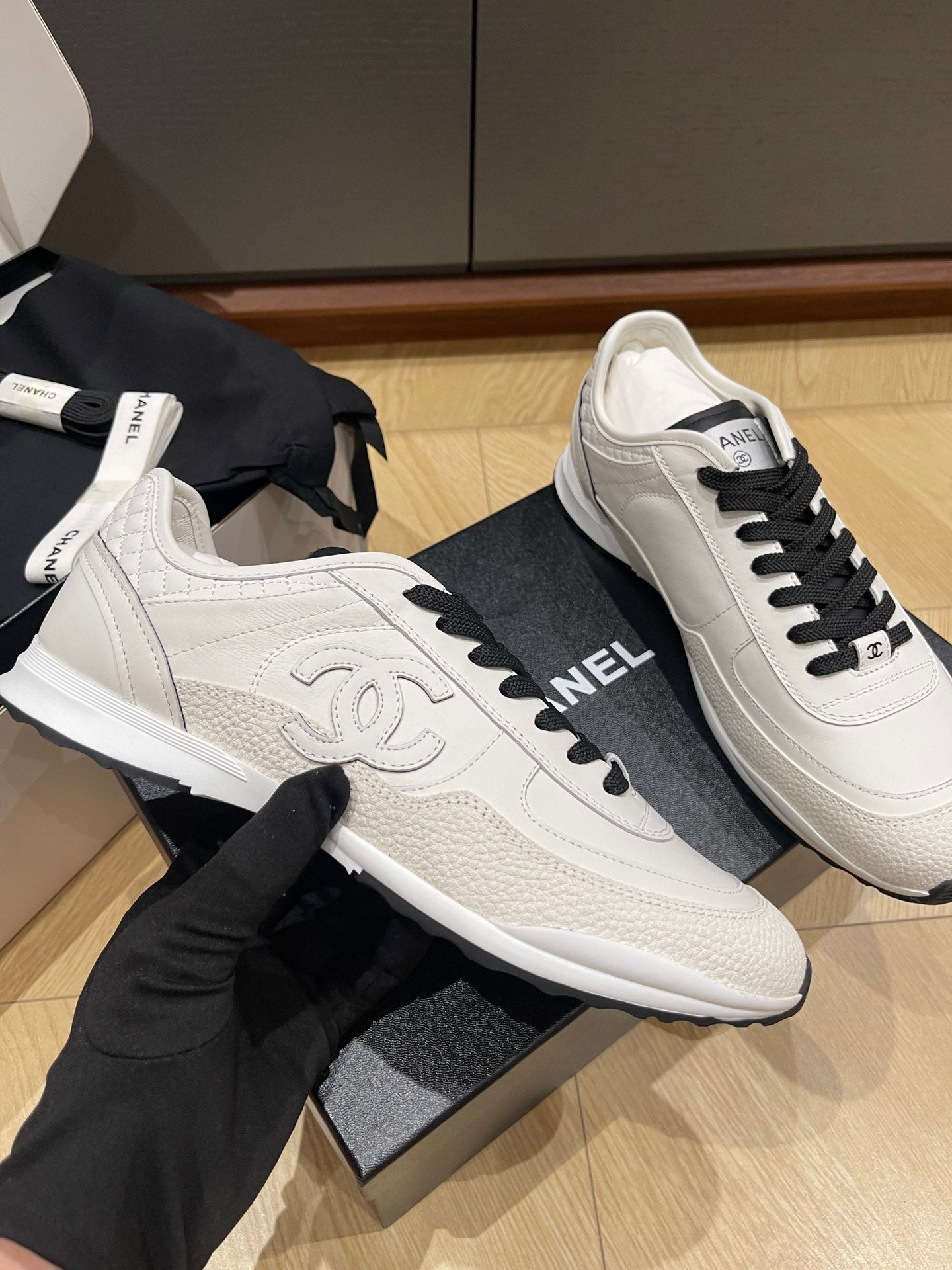 Chanel unisex low-top sneakers, white textured leather with black laces and CC detail