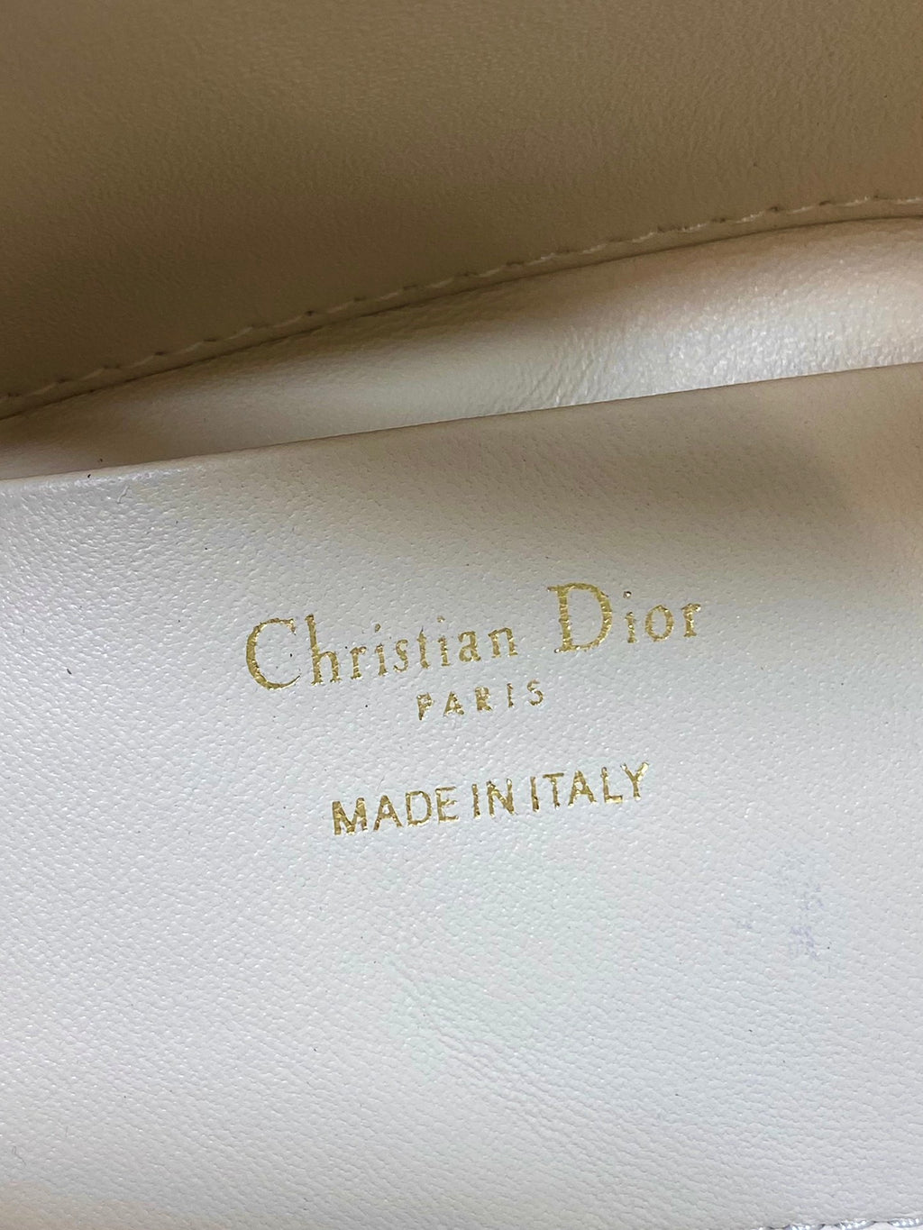 Dior cream leather interior stamp: “Christian Dior PARIS” and “MADE IN ITALY”
