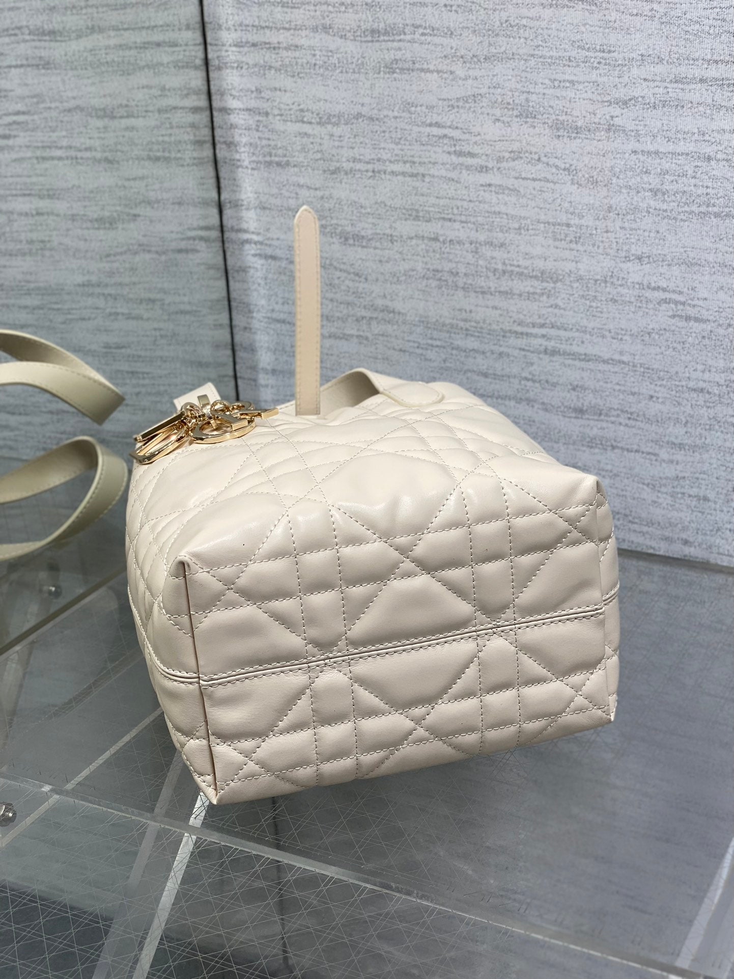 Dior cream quilted mini handbag with top handle and gold-tone chain strap