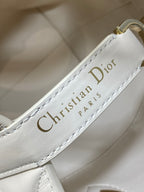 Dior cream leather label inside handbag reading “Christian Dior PARIS”