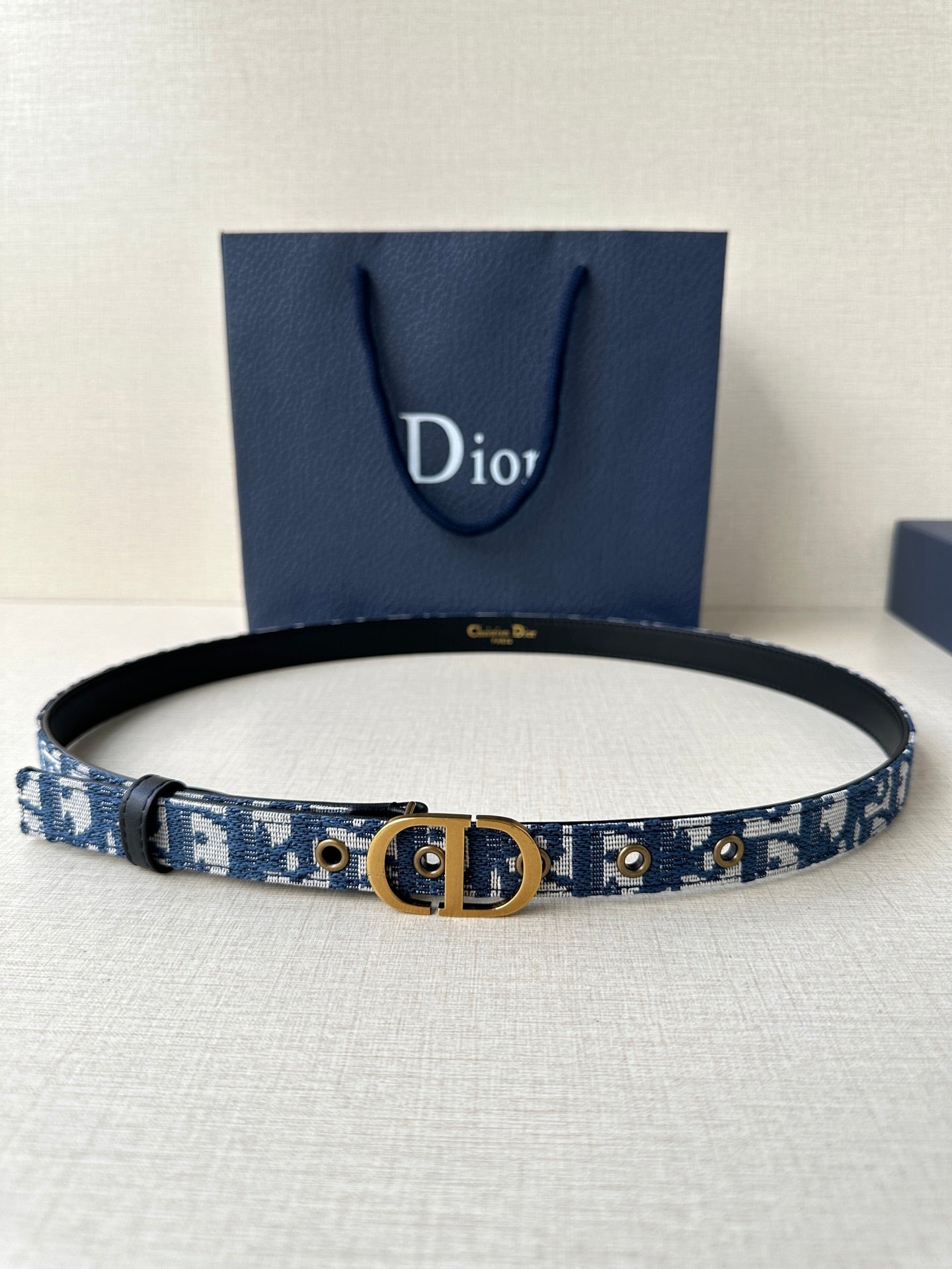 Dior belt, blue woven logo strap with gold-tone buckle and black leather trim