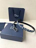 Dior belt with blue logo-pattern strap, silver buckle and black leather keeper