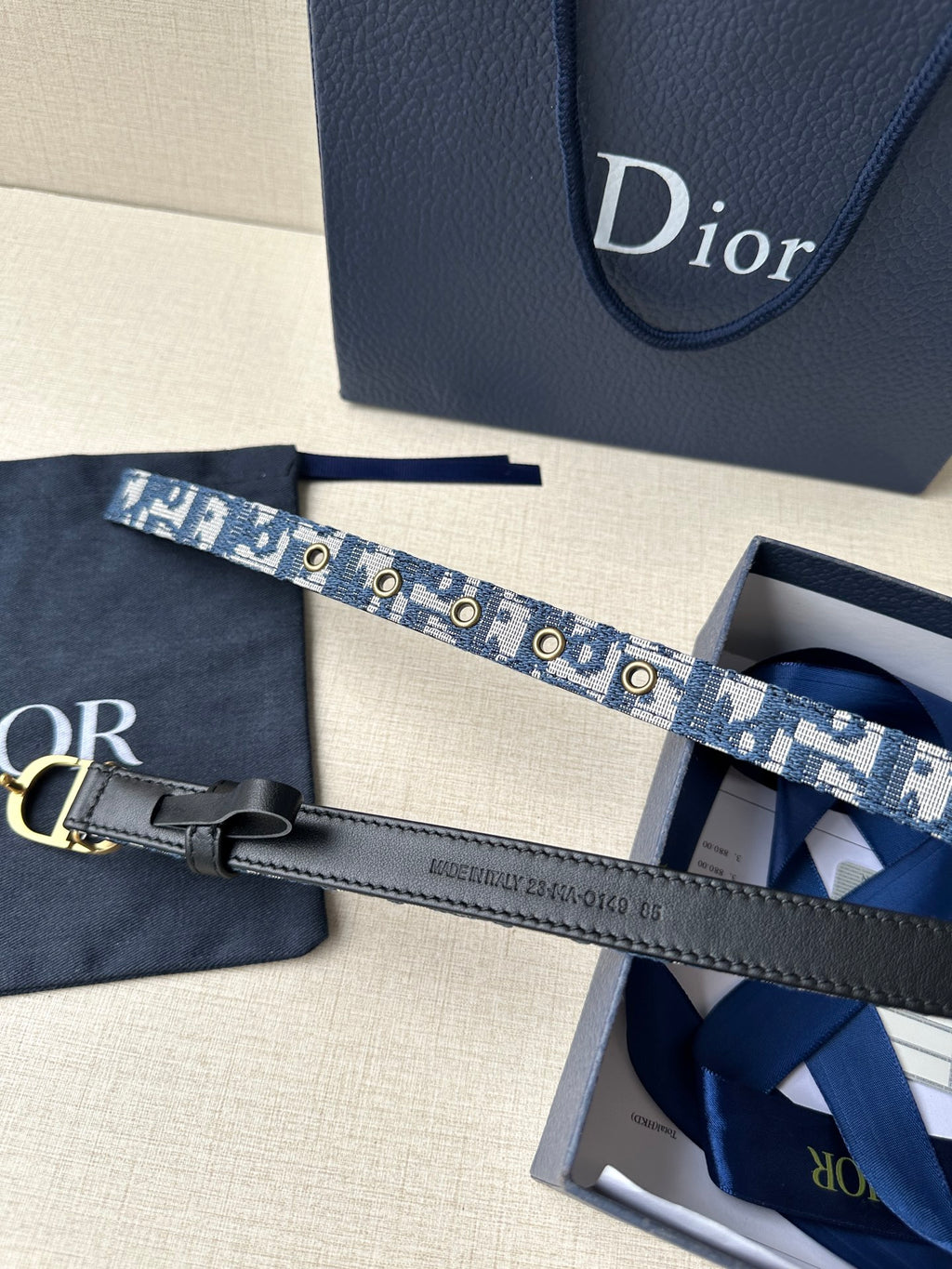 Dior belt with blue monogram strap, gold CD buckle and leather tag