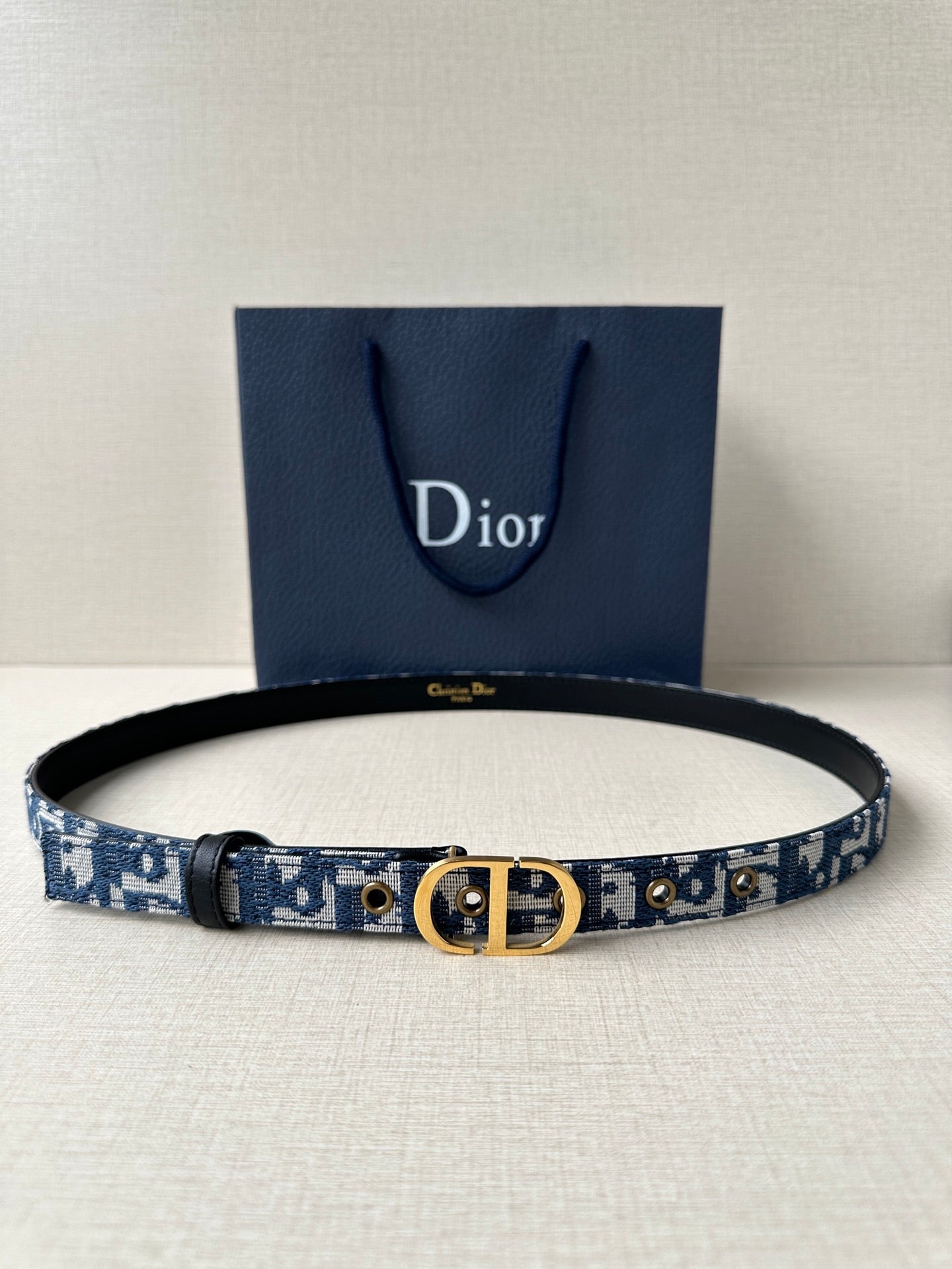 Dior belt with blue monogram strap and gold CD buckle, black leather trim
