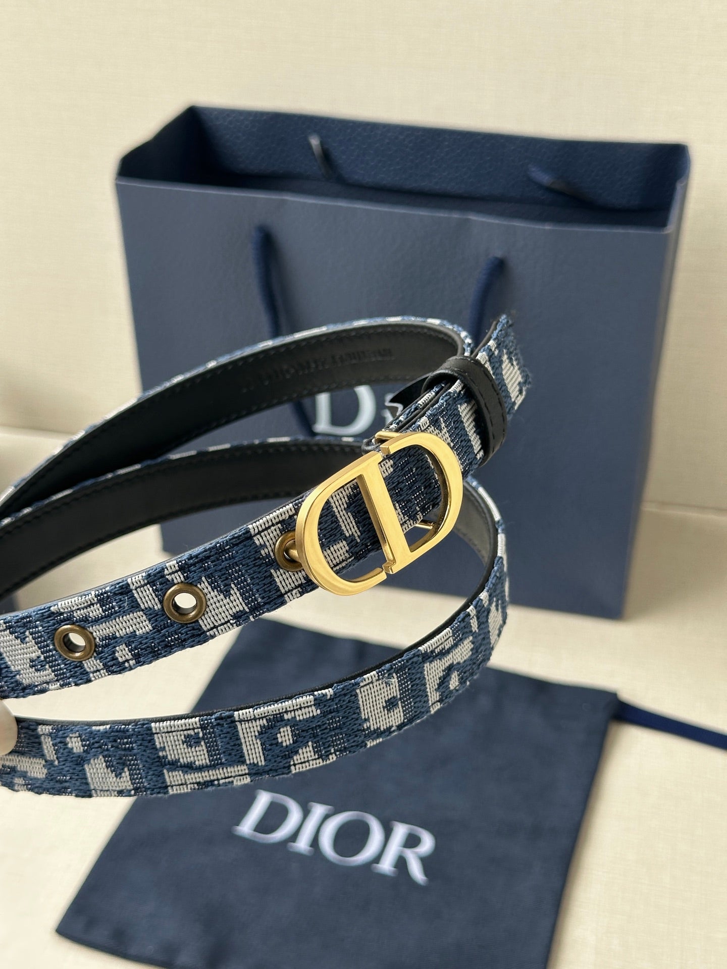 Dior belt with blue monogram strap, gold CD buckle and black leather backing