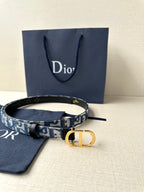 Dior belt with blue patterned strap, gold CD buckle and matching fabric pouch