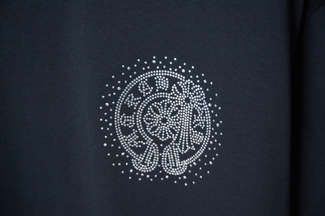 Dark navy T-shirt with circular rhinestone elephant graphic on front