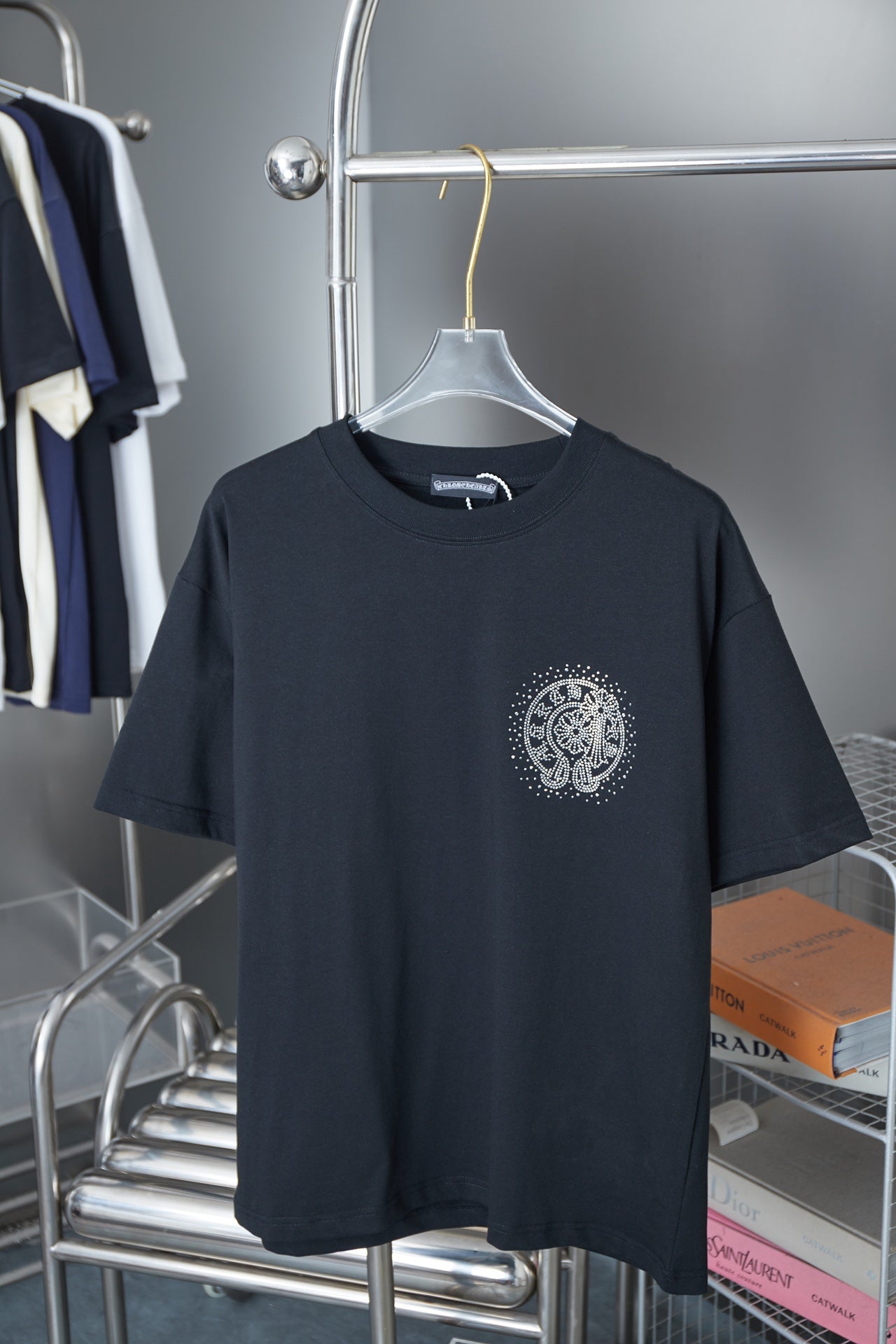 Dark navy short-sleeve crewneck T-shirt with small circular rhinestone graphic