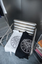 Black and white short-sleeve T-shirts with rhinestone round emblem on front