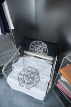 White and black short-sleeve T-shirts with silver rhinestone medallion on chest