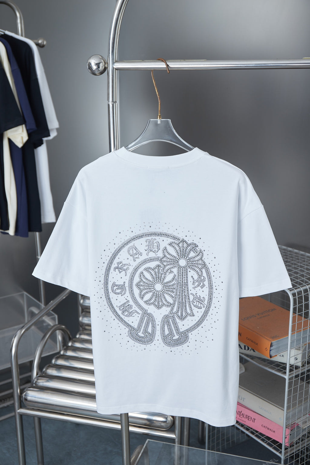 White short-sleeve T-shirt with large silver rhinestone medallion on back