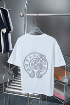 White short-sleeve T-shirt with large silver rhinestone medallion on back