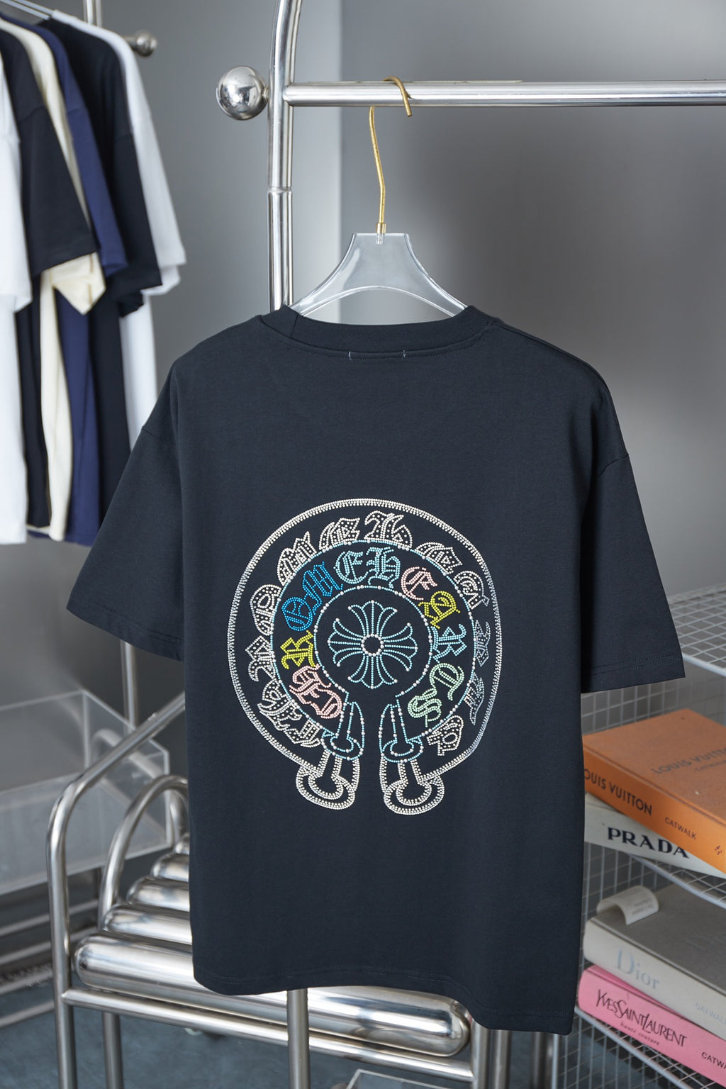 Black crew-neck T-shirt with large circular rhinestone graphic on back