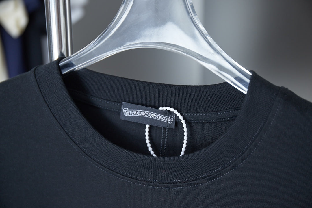 Black T-shirt neckline with beaded trim and inner neck label