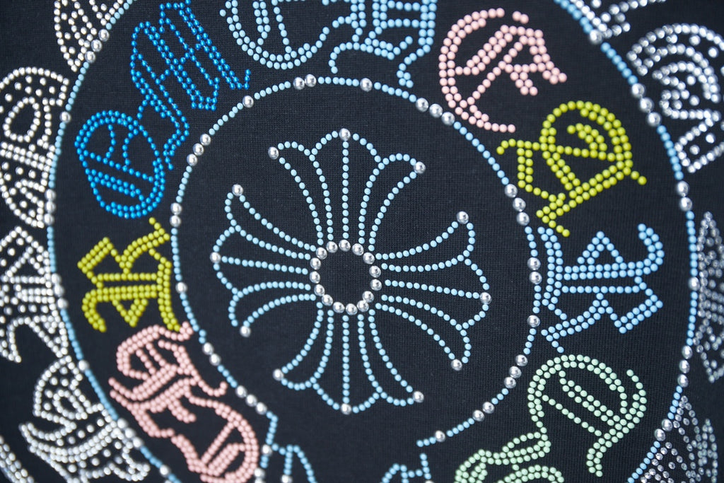 Black T-shirt close-up: rhinestone circular pattern with multicolor accents