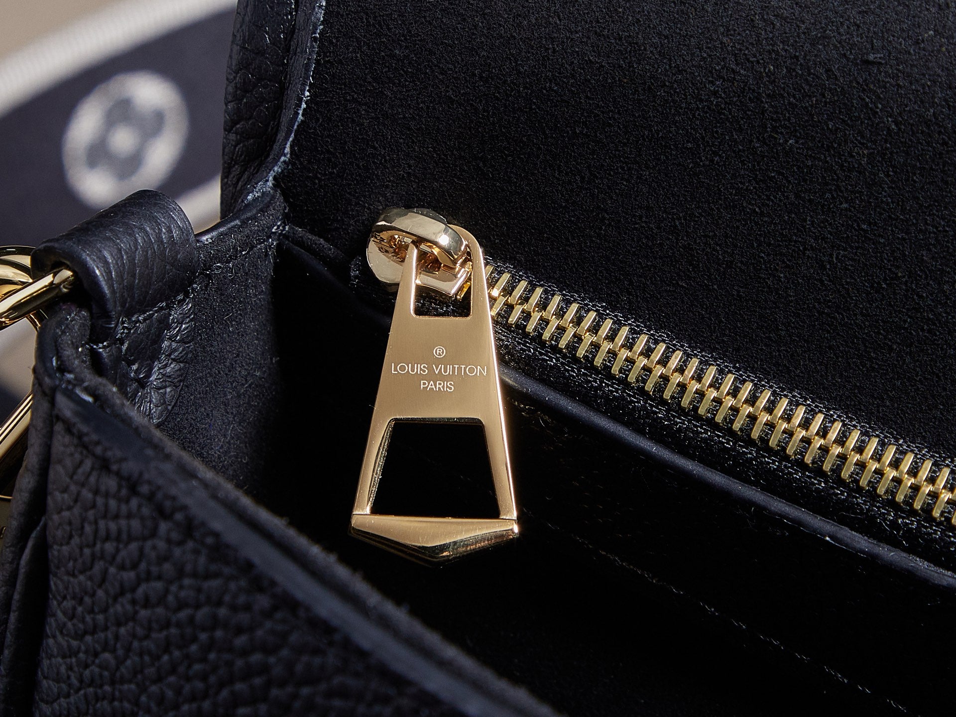 Louis Vuitton bag zipper pull, gold tone with monogram charm