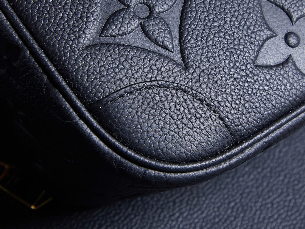 Louis Vuitton bag corner detail, embossed monogram leather with curved seam