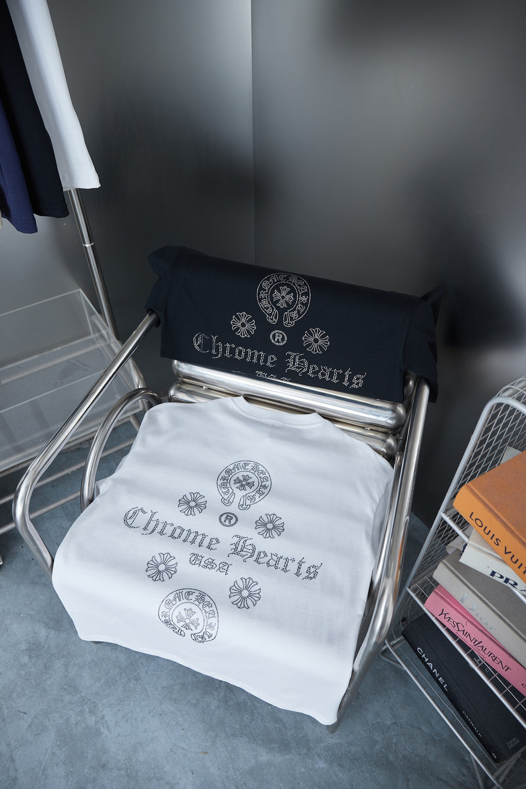 Chrome Hearts T-shirts, white and black, folded on metal rack