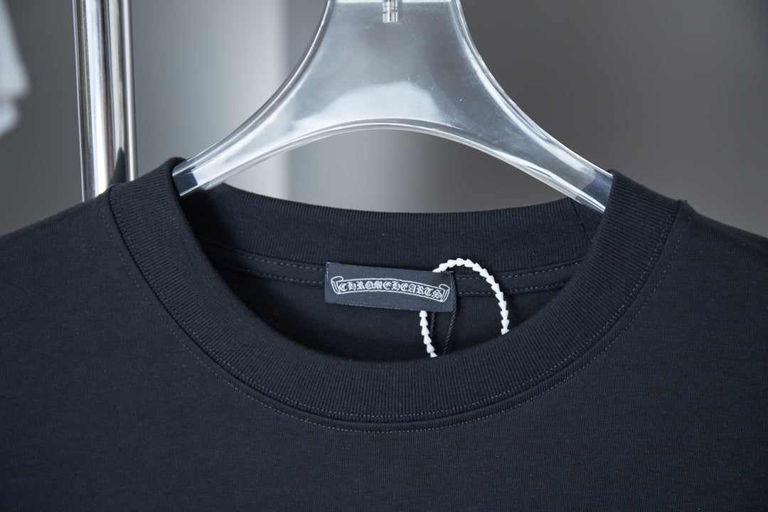 Dark blue T-shirt collar close-up with brand label and neckline stitching
