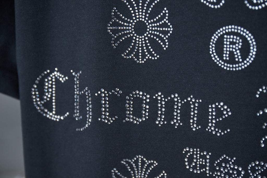 Dark blue T-shirt rhinestone-style 'Chrome Hearts' lettering with circular R motif