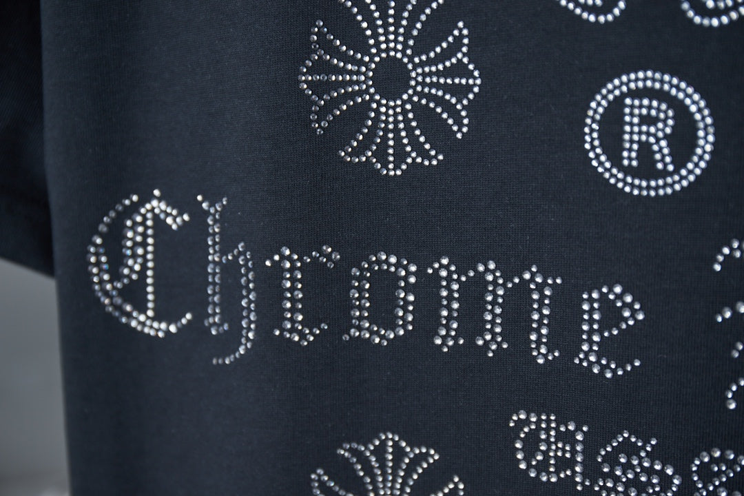 Dark blue T-shirt rhinestone-style 'Chrome Hearts' lettering with circular R motif
