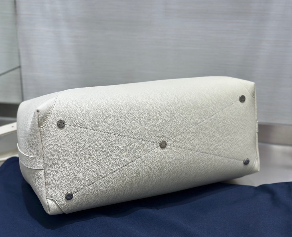 White Dior handbag base with corner studs and stitched panel detailing