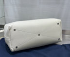 White Dior handbag base with corner studs and stitched panel detailing