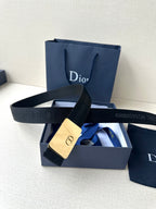 Dior belt with dark strap and gold rectangular buckle with Dior emblem
