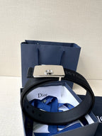 Dior belt with black textured strap and silver buckle plate with Dior emblem
